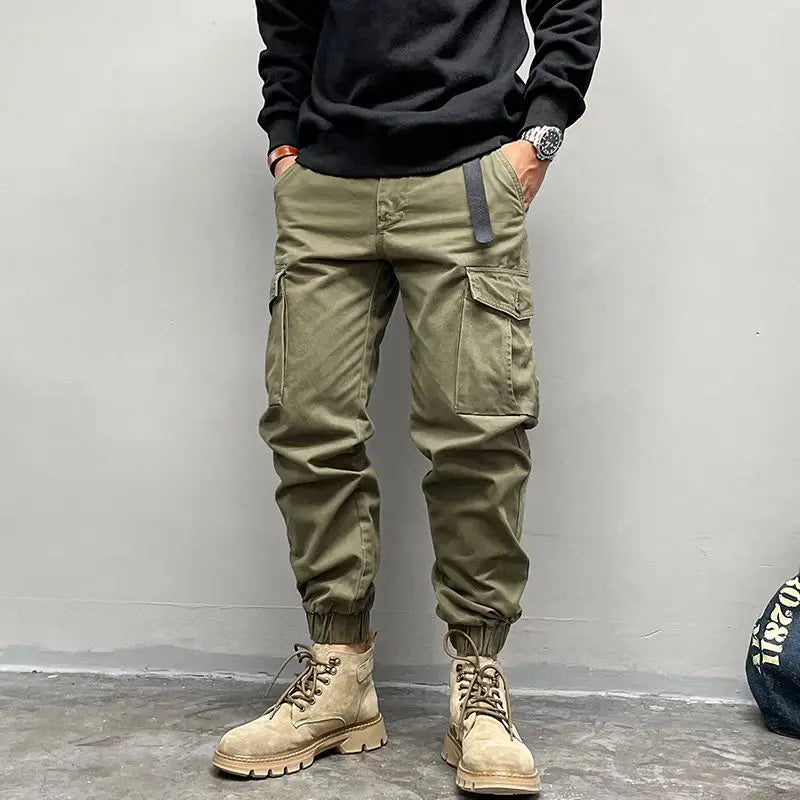 Solto masculino cor sólida grande bolso botão carga calças moda homem novo clássico rua casual ligar um dos pés calças masculinas