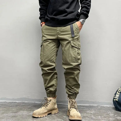 Solto masculino cor sólida grande bolso botão carga calças moda homem novo clássico rua casual ligar um dos pés calças masculinas