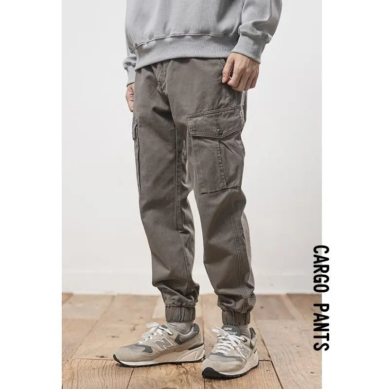 Solto masculino cor sólida grande bolso botão carga calças moda homem novo clássico rua casual ligar um dos pés calças masculinas