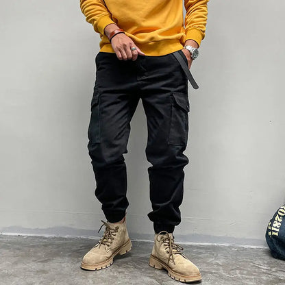 Solto masculino cor sólida grande bolso botão carga calças moda homem novo clássico rua casual ligar um dos pés calças masculinas
